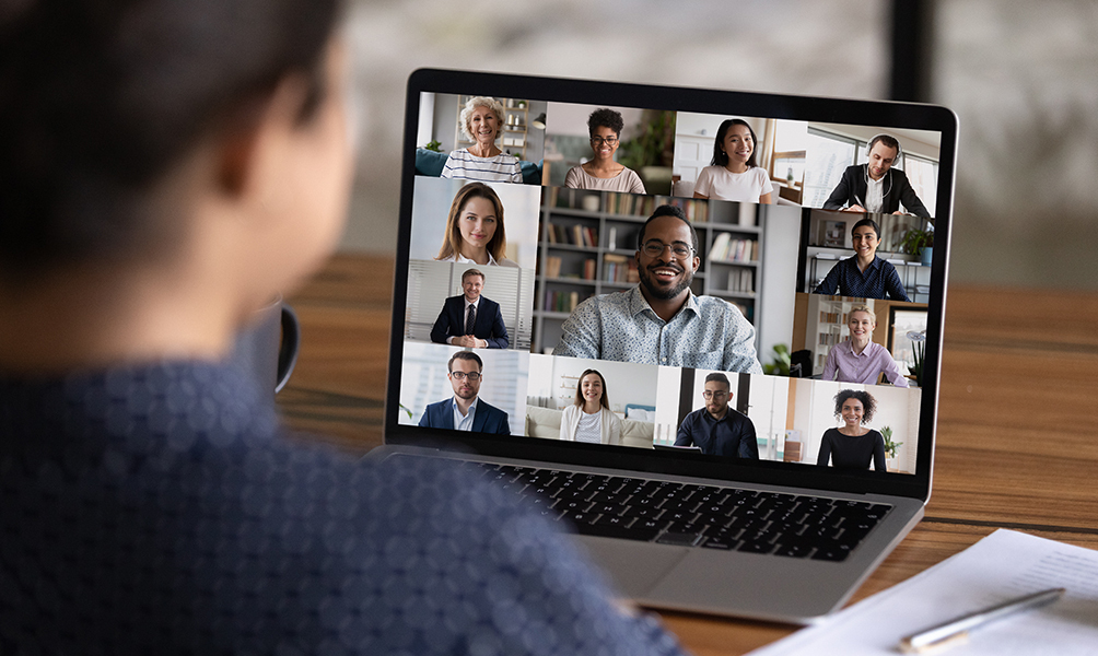 An over-the-shoulder look at a group of people on a virtual call